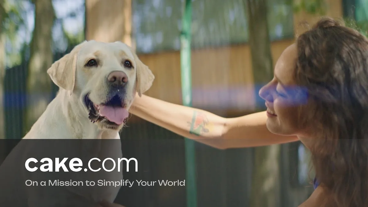 CAKE.com campaign thumbnail showing a woman petting a yellow Labrador beside the campaign title On a Mission to Simplify Your World.